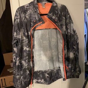 Lightly worn light weight rain jacket. Size large